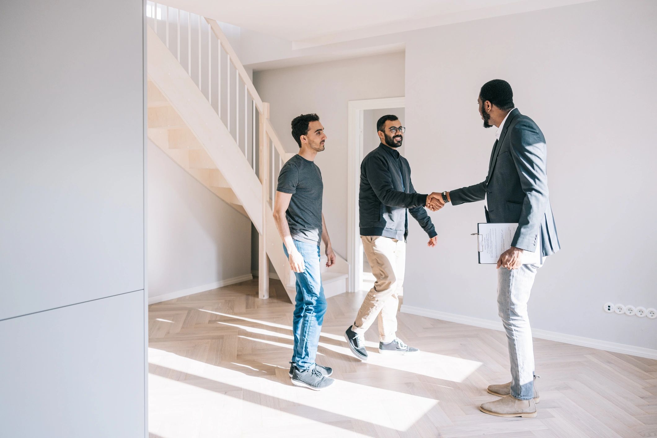 Real estate representative greeting prospective renters